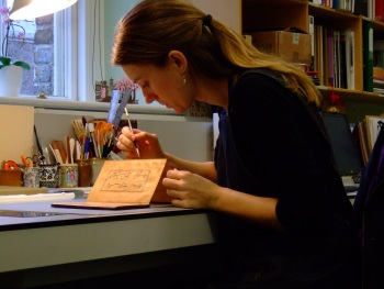 Rachel Sawicki conserving a Persian concertina binding